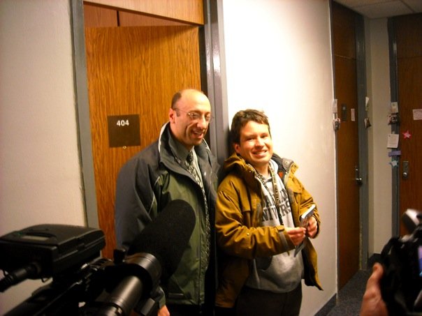 Micah with his lawyer Chris Davis in front of his dorm room at OU