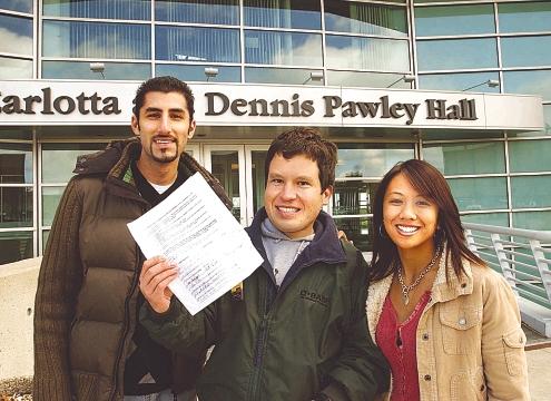 Micah with friends holding his petition with over 1000 signatures