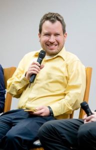 Micah speaking at a Syracuse University event